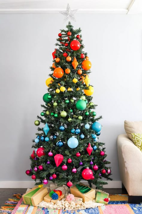 Add a ton of color to your holidays with rainbow Christmas tree decorations! This vibrant tree features a mix of purchased and DIYed ornaments for the perfect mix of rainbow goodness! #christmas #christmastree #rainbow #rainbowtree Christmas Tree Multi Color Decorations, Rainbow Ornaments Christmas Tree, Classic Colorful Christmas Tree, Primary Color Christmas Tree, Rainbow Theme Christmas Tree, Colorful Xmas Tree, Bright Color Christmas Tree, Multi Color Christmas Tree Decorations, Multicolor Christmas Tree Decorations