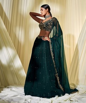 Bottle Green Lehenga Set - DISHA MUCHHALA - 4008113 Bottle Green Indian Outfit, Dark Green Lehenga Designs, Indian Designer Blouses, Trending Lehenga Designs 2023, Lehenga Designs Green, Wedding Guest Lengha, Dark Lehenga, Green Lehenga Designs, Formal Lehenga