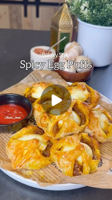 Fathima Yusuf (Shadiya) on Instagram: "Save this !! Ramadan series Episode:12  Spicy Bakery Style Egg Puffs !!  A savory delight for any time of the day & a nostalgic recipe which is has so many good memories having it fresh from the bakery every morning before leaving for school. It’s spicy slightly sweet and has everything you need in a flaky puff..   LIKE, SAVE, SHARE the reel & FOLLOW @shadi_faleel for more easy recipes.  You’ll need 5 eggs hard boiled and cut into halves  1/3 cup Oil 4 Sliced red onions  4 cloves of Chopped Garlic  1 tsp Salt or slightly more according to your taste  1 tsp Turmeric powder  1 tsp Cumin powder  1 tsp Red chilli powder  2 tsp Chilli flakes 1 tsp Kashmiri chilli powder (optional) 1 & 1/2 tbsp Sugar Juice of half a Lime Few Curry leaves (optional )  One eg Egg Puffs Recipe, Egg Puff Recipe Indian, Egg Puff Recipe, Egg Recipes Indian, Ramadan Series, Ya Nabi, Kashmiri Chilli, Egg Puff, Spicy Eggs