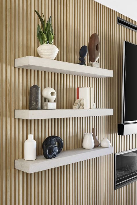 Fluted Wall With Shelves, Wall Panelling With Shelves, Shelves On Slat Wall, Living Room Cladding Wall, Floating Wall Panels, Slat Wall Playroom, Wood Slat Wall With Floating Shelves, Slat Wall Floating Shelves, Living Room Ideas Wood Panel Walls