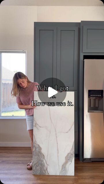 Valeria Jacobs on Instagram: "What I Got vs. How We Used It: Kitchen Reveal!  My SIL loves the look of marble, but not the maintenance or the price tag. So, when I found this gorgeous large format tile from @thetileshop, I knew it would be the perfect alternative for the backsplash. #thetileshoppartner Compared to the thousands a marble slab would cost, we spent under $600 on tile, and it perfectly completed the vision we had for this space.  The key to this project was getting a couple of extra boxes so we had enough tile to work with. We started by laying all the tiles out on the floor like a big puzzle, carefully matching the pattern as closely as possible for a seamless look. While this kitchen is full of DIYs, we decided to hire professional tile installers due to timing. However, wit Kitchen And Dining Room Tile Floors, Large Marble Tile Backsplash Kitchen, Large Tiles Backsplash, 12x24 Tile Backsplash Kitchen, Kitchen Backsplash Big Tiles, Large Tile Kitchen Countertops, Kitchen Backsplash Large Tile, Large Format Tile Countertop, Alternatives To Tile Backsplash