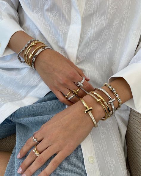 11 Luxury Pieces That Are Worth the Investment | Who What Wear UK Luxury Designer Bracelet Stack, Tiffany T Bracelet Stack, Luxury Jewelry Stack, Cartier And Tiffany Bracelet Stack, Tiffany Stacked Bracelets, Investment Jewelry Pieces, Classy Bracelet Stack, Bracket Stack Ideas, Stack Bracelet Ideas