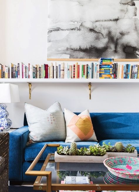 Living room with large art, a wall of books, and a blue velvet sofa Shelves Above Sofa, Amazon Living Room Decor, Amazon Living Room, Shelves Above Couch, Design For Small Spaces, Chic Loft, Farmhouse Living Room Decor, Floating Bookshelves, Above Couch