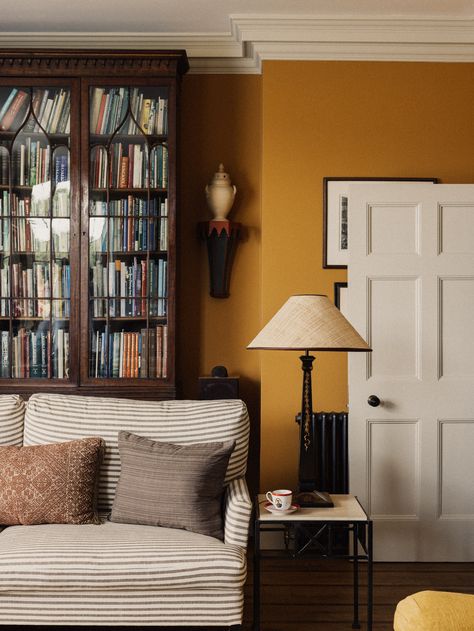 Farrow And Ball Mustard Yellow, Colours That Go With Mustard, Farrow And Ball India Yellow Living Room, Mustard Fireplace, Honey Oak Floors Living Room Decor, Yellow Living Room Aesthetic, Warm Color Living Room Ideas, White Trim Living Room, Mustard Hallway