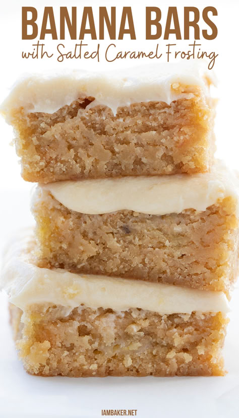 Three banana bars are stacked on top of each other on a white countertop. Ooey Gooey Banana Bars, Not Overly Sweet Desserts, Banana Bars With Frosting, Banana And Caramel Desserts, Banana Cake With Salted Caramel Frosting, Banana Easter Dessert, Carmel Desserts Bars, Salted Caramel Banana Ritz, Christmas Baking With Bananas