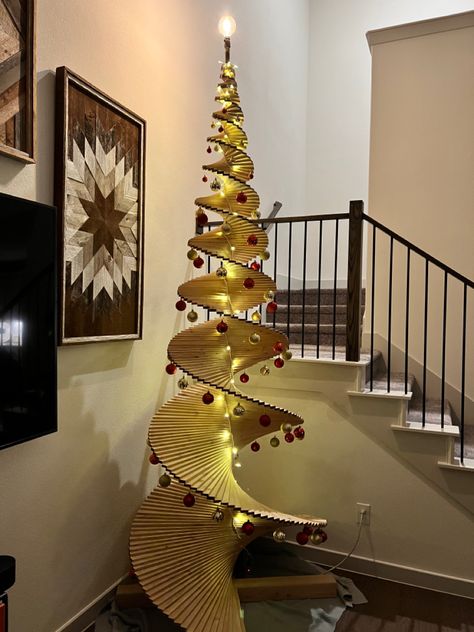 255 individual wooden panels male up this spiraling christmas tree. Topped with an edison bulb for the star! Christmas Tree Spiral, Wooden Christmas Tree, Wooden Christmas Trees, Wooden Christmas, Edison Bulb, The Star, Dream Home, Dream House, Christmas Tree