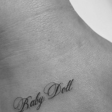 Mikella Blue on Instagram: "baby doll ♡  -  For booking click link in bio  -  #tattoo #losangeles #MikellaBlue #tattooartist #ladytattooer #fineline #blackandgrey #script #babydoll" Babydoll Tattoo Lettering, Doll Tattoo Word, Babydoll Tattoo Ideas, Tattoos For Women Black Women, Baby Doll Tattoo, Babydoll Tattoo, Doll Tattoo Ideas, Tattoos For Baby Boy, Ethereal Tattoos