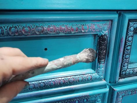 I found this great canvas of a peacock at a yard sale and knew instantly I want to paint a dresser to match. Inspiration Picture    My first step was to choose paint colors that I saw in the canvas.I knew I wanted a blue for the final coat, so I chose the accent colors. Prep    This dresser was perfect for the look I was going for. I removed the hardware so that I could paint that separately. Then I cleaned my piece with a mixture of TSP and water. Since I was using chalk paint I did n… Chalk Paint Hutch, Paint A Dresser, Removing Baseboards, Bronze Spray Paint, Top Paint Colors, Painted Hutch, Spray Paint Colors, Bedroom Furniture Makeover, Pallet Bar