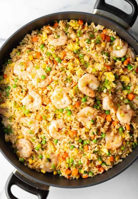 Deep black skillet with cooked shrimp, rice, scrambled eggs, and veggies. Eggs And Veggies, Shrimp Fried Rice Recipe, Christmas Main Dishes, How To Make Shrimp, Shrimp Rice, Soup Starter, A Spicy Perspective, Cooked Shrimp, Flavorful Dinner