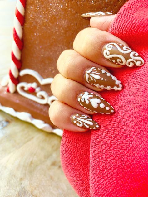 Cute nail art if brown matte nails to look like gingerbread with the nail design in white, puffy, icing in cute gingerbread cookie designs like swirls, loops, hearts and dots to edge and decorate each nail! Gingerbread Nails, Cute Nail Polish, Icing Design, Xmas 2024, Festive Nail Art, Cute Christmas Nails, Twinkle Toes, Christmas Nails Acrylic, Get Nails