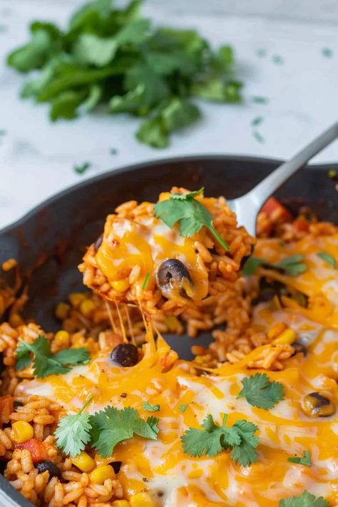 Cheesy Enchilada Rice Skillet Chicken Enchilada And Rice, Cheesy Enchilada Rice Skillet, Spicy Rice Recipes, Enchilada Rice Skillet, Rice Beans Corn, Enchilada Bowl, Spicy Rice Recipe, Paleo Rice, Mexican Street Corn Salad Recipe