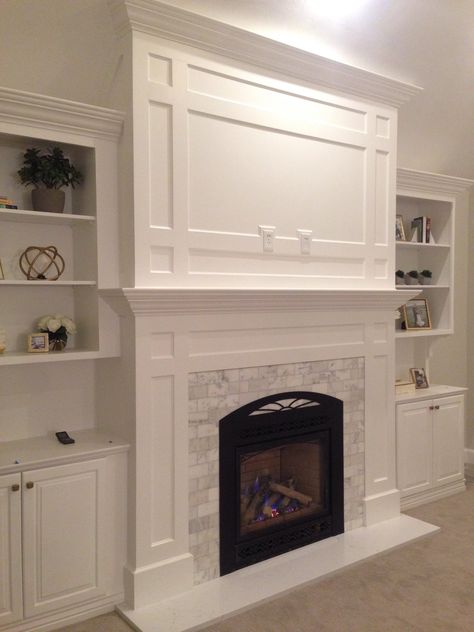 Shaker Style Fireplace, Fireplace With Millwork Surround, Trim Work Above Fireplace, Glass Tile Fireplace Surround, Faux Foyer, Fireplace Bookcase, Fireplace Modern Design, Built In Around Fireplace, Fireplace Mantel Designs