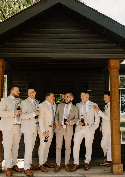 Tan Bridal Party Groomsmen, Suits For The Groom Wedding Day, Taupe Mens Wedding Attire, Modern Wedding Groomsmen, Groomsman Neutral Colors, Groomsmen No Tie With Jacket, Groom Different Suit Than Groomsmen, Greige Groomsmen Attire, Groom And Groomsman Suit