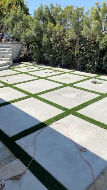 Square Grass Backyard, Cement Pavers With Grass In Between, Grass And Concrete Backyard, Stone And Grass Driveway, Pavement Design Paving Pattern Driveways, Cement Squares With Grass In Between, Stone And Grass Patio, Driveway With Grass In Between, Concrete Slabs Backyard