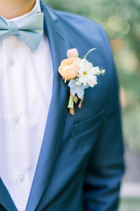 Groom Suit Flower Boutonnieres, Peach Blue Boutonniere, Blue Wildflower Boutonniere, Blue Suit Spring Wedding, Spring Groom Boutonniere, Light Blue And Pink Boutonniere, Grooms Corsage Wedding, Garden Party Boutonniere, Boutonniere Wedding Spring