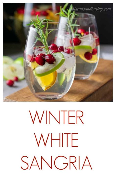 White Sangria features white cranberry juice and makes a perfectly festive lower alcohol libation. White Cranberry Mimosa, Christmas White Wine Sangria, Winter White Sangria Recipe, White Sangria Recipe Christmas, White Winter Sangria, Winter White Sangria, Christmas White Sangria, White Cranberry Sangria, Beach Beverages