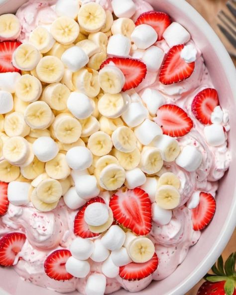 Easy and irresistible, this Strawberry Banana Cheesecake Salad recipe is your go-to for gatherings—find out how to whip up this crowd-pleaser!