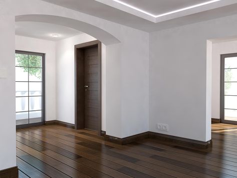 Baseboards Match Wall Color, Tile Baseboard Living Room, Brown Molding Wood Trim, Dark Baseboards Light Walls, Walnut Baseboards And Trim, Dark Brown Baseboards, Wood Floor And Trim Combinations, Dark Molding Light Walls, Paint Baseboards Same Color As Wall