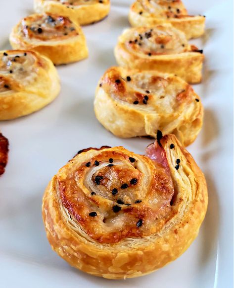 Roll Ups puff pastry pinwheels appetizers with ham and cheese on a white platter Ham Cheese Puff Pastry Pinwheels, Ham Appetizers, Ham Cheese Puff Pastry, Pinwheels Appetizers, Puff Pastry Appetizer, Pastry Pinwheels, Ham And Cheese Roll Ups, Puff Pastry Pinwheels, Ham And Cheese Pinwheels