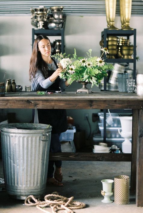 big, tall wood table with durable top, big garbage can, racks for hard goods...Honey of a Thousand Flowers // Sarah Winward Vase Storage Ideas, Floral Studio Work Spaces, Florist Table, Shop Interiors Boutique, Sarah Winward, Industrial Studio, Flower Shop Interiors, Florist Studio, Flower Shop Ideas