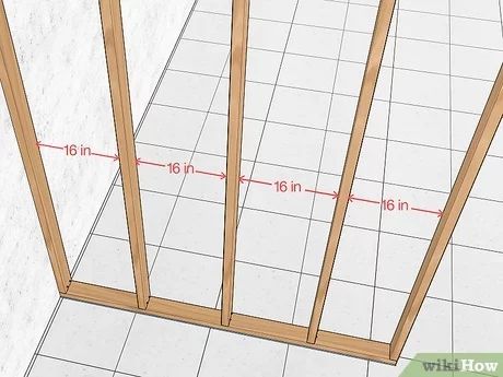 How to Build a Fake Wall: 12 Steps (with Pictures) - wikiHow How To Frame Out A Wall, How To Put Up A Temporary Wall, Build A Partition Wall, How To Build A Stud Wall Diy, How To Build Interior Wall, Framing Walls How To Build, Frame A Wall Diy, How To Build A False Wall, Diy Build A Wall Cheap