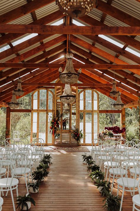 Bush chapel with timber floor, chandeliers and mirrored altar featuring white chairs and an overall rustic wedding chapel setting. Image: Gui Jorge Wedding Venues Cheap, Wedding In The Bush, Australia Wedding Venues, Wedding Venues Australia, Small Chapel Wedding, Australian Bush Wedding, Wedding Venue Australia, Bush Wedding Australian, Bush Wedding South Africa