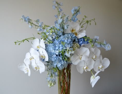 Light Blue Orchids, Blue Orchid Centerpieces Wedding, White Hydrangea With Blue Delphinium, Blue And White Hydrangea Arrangements, Blue Orchid Arrangements, Blue Hydrangea Bouquet Aesthetic, Orchid Hydrangea Bouquet, Orchid And Hydrangea Bouquet, Blue White Flower Arrangements