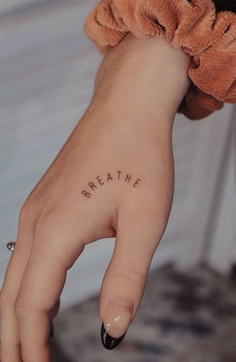 70+ Beautiful Tattoo Designs For Women : Breath Tattoo on Hand I Take You | Wedding Readings | Wedding Ideas | Wedding Dresses | Wedding Theme Breath Hand Tattoo, Breathe Hand Tattoo, Breath Tattoo, Tattoos That Mean Something, Just Breathe Tattoo, Simple Hand Tattoos, Wörter Tattoos, Side Hand Tattoos, Beautiful Tattoo Designs