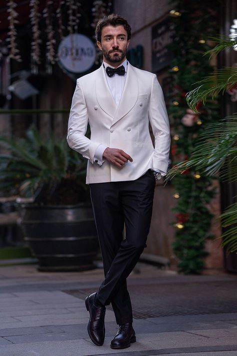 Radiate pristine sophistication in the White Double-Breasted Tuxedo 2-Piece by VIOSSI, featuring a classic double-breasted design tailored for timeless elegance in a striking, immaculate white hue. #whitetuxedo #doublebreastedtuxedo #VIOSSI #mensfashion #timelesselegance #sophisticatedlook #tuxedostyle #classicwhite Double Breasted White Suit, Mens White Suit Wedding, White Coat Black Pants Men, Tuxedo For Men White, Mens White Tuxedo, Tuxedo For Men Wedding, Tuxedo Double Breasted, Mens White Suit, Double Breasted Suit Men