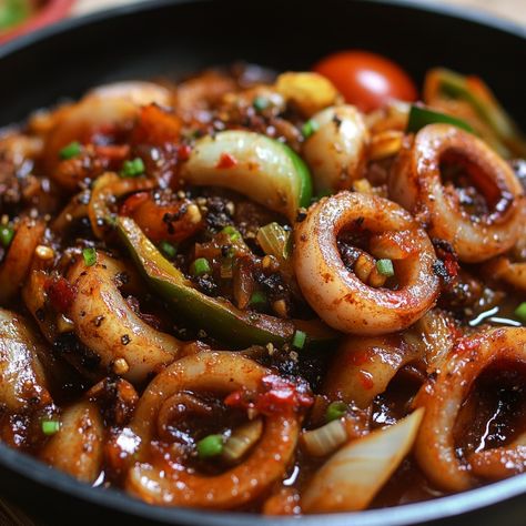 🦑🍛 Dive into the savory goodness of Adobong Pusit—tender squid cooked in a tangy, flavorful adobo sauce! 😋 #AdobongPusit #FilipinoFavorites Adobong Pusit (Squid Adobo) Ingredients: Squid (500g, cleaned and sliced) Soy sauce (1/4 cup) Vinegar (1/4 cup) Garlic (4 cloves, minced) Onion (1, chopped) Tomato (1, chopped) Bay leaf (1) Black peppercorns (1 tsp) Salt and pepper (to taste) Instructions: Sauté garlic, onion, and tomato in a pan until softened. Add squid, soy sauce, vinegar, bay leaf... Adobo Ingredients, Pusit Recipe, Adobong Pusit, Squid Recipes, Instagram Recipes, Adobo Sauce, Food Instagram, Savory Food, Presentation Ideas