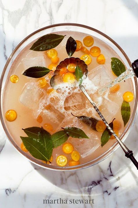 Filled with seasonal ingredients and prepared for a large crowd, we can't think of a better big-batch cocktail for New Year's Eve than this one. It's sparkling, sweet, and totally spectacular. #marthastewart #recipes #recipeideas #holidaypartyfoods #newyearfoods #cocktailpartyrecipes Cooler Recipes, Sangria Summer, Sparkling Punch, Nye Cocktail, Batch Cocktail Recipe, Citrus Punch, Summer Punch, New Years Cocktails, White Cranberry Juice