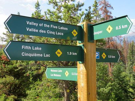 Hiking trail signs in Jasper National Park Alberta Canada. Valley of the Five Lakes is a popular hike in the Canadian Rockies. Perfect stop on the Icefields Parkway just south of Jasper. #alberta #canada #hikingtrails Learning Center Design, Hiking Signs, Trail Signage, Jasper National Park Canada, Street Name Sign, Trail Markers, Hiking Hacks, Bike Party, Park Signage