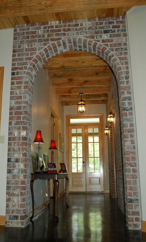 archway made of different material than walls to break up the space and make it look less long Unique Home Architecture, Brick Archway, Brick Arch, Casa Country, Home Architecture, Brick And Wood, Brick Walls, Tall Ceilings, Exposed Brick