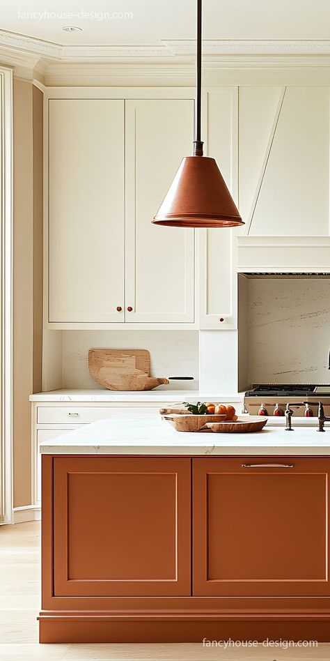 The cabinets in a mushroom color paired with burnt orange tones add a refreshing, coastal vibe to the kitchen. Dark Orange Kitchen Cabinets, Persimmon Kitchen Cabinets, Rust Colour Kitchen, Kitchen Paint Color With White Cabinets, Burnt Orange Kitchen Ideas, Kitchen Cabinets Painted Same Color As Walls, White Cabinets With Colored Walls, Rust Colored Kitchen Cabinets, Clay Color Kitchen