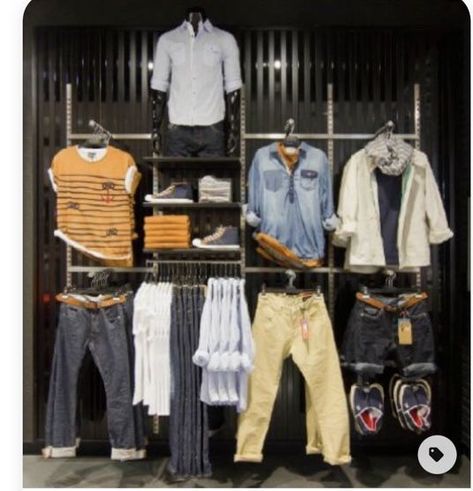 This is an excellent use of space. Each item is exactly the right size. It can accommodate a large amount of inventory without becoming crowded. This display can include both designs and mannequins wearing T-shirts. The outfits are displayed and hung in different outfit orders on this wall display, which has a great layout. Mens Shop Interior Store Design, Clothing Store Displays Men's, Mens Store Display, Men's Clothing Store Design, Retail Layout, Denim Display, Boutique Store Displays, Mens Boutique, Visual Merchandising Fashion