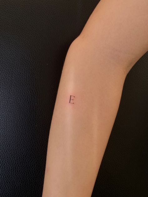 Aesthetic Letter Tattoo, Letter E Finger Tattoo, Small E Tattoo Letter, Ella Tattoo Name, Initial E Tattoo, E Tatoos Letter, Letter Arm Tattoo, Tattoo Letra E, Cursive E Tattoo