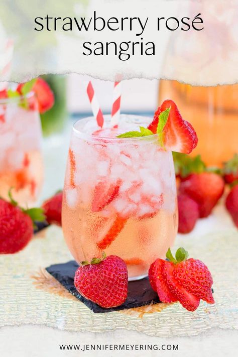 Strawberry Rosé Sangria - Jennifer Meyering Pink Sangria Recipes, Strawberry Rose Sangria, Pink Sangria For A Crowd, Valentines Sangria Recipes, Pink Sangria Recipe, Valentines Sangria, Rose Sangria Recipes, Sangria With Vodka, Rosé Sangria