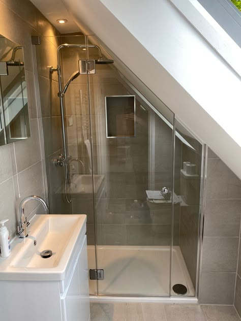 Loft And Sloping Ceiling Showers, Small Ensuite Ideas Sloping Roof, Small Angled Ceiling Bathroom, Tiny Bathroom Sloped Ceiling, Small Attic Bathroom Ideas Slanted Ceiling, Bathroom Eaves Ideas, Bathroom In Eaves Small Spaces, En Suite Shower Room In Eaves, Slanted Roof Apartment