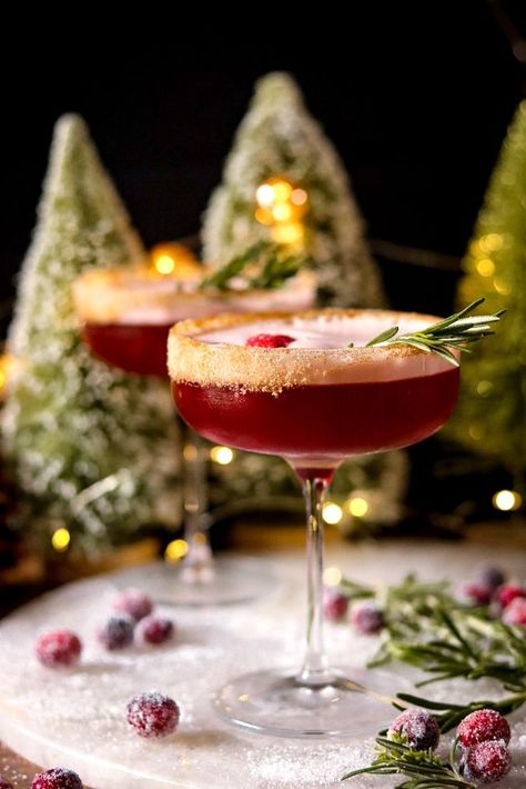 Festive and refreshing! Spiced rum mingles with cranberry, orange liqueur, and an infused maple simple syrup for a cozy and crisp winter cocktail. Spiced Simple Syrup Cocktails, Christmas Cocktail Presentation, Rum Rum Rudolph, Thanksgiving Cranberry Cocktail Recipes, Cozy Christmas Cocktails, Nuts And Berries Cocktail, Best Holiday Cocktail Recipes, Christmas Craft Cocktails, Vegan Christmas Cocktails