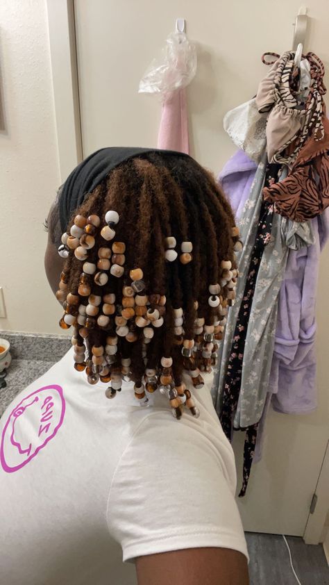 #starterlocs #2strandtwist #twostrandtwist #twostrandtwistlocs #locstyles #locs #locstylesforwomen #blackhairstyles #locjourney #blackwomenwithlocs #blackwomenshairstylesnatural #lochairstyles Short 2 Strand Twist Starter Locs, Very Short Locs With Beads, Natural Locs With Beads, Two Strand Twist Locs With Beads, Two Strand Loc Bob, Locs With Wooden Beads, Affordable Lace Front Wigs, Hair Twists Black, Weave Hairstyles Braided