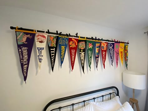 Pennant Wall Display, Decorating With Pennants, Sports Pennant Display, How To Hang Pennants On Wall, Pennant Decor Ideas, Pennant Flag Display, Vintage Pennant Decor, Pennant Flags Decor, Vintage Camp Interior