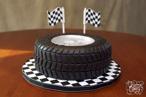 Vanilla cake with vanilla frosting, covered in fondant. We lost count of how many treads were individually placed! Tyre Cake, Tire Cake, Motorcycle Cake, Wheel Cake, Shaped Cake Pans, Truck Cakes, Fathers Day Cake, Cake Birthday Cake, Car Cake