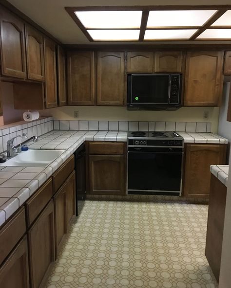 Wooden cabinets in kitchen before renovation. 1980 Kitchen, 80s House Interior, Modern Tile Backsplash, 1980s House, 1980s Kitchen, 80s Kitchen, 80s House, Home Remodel Before And After, Before After Kitchen