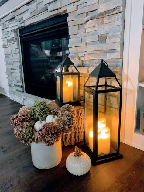 Fall Fireplace Decor With Lanterns, Lantern Entryway Decor, Lanterns For Fireplace, Floor Lantern Decor Ideas, Living Room Lantern Decor, Candle Lanterns Decor Ideas Living Room, Floor Fireplace Decor, Lantern By Fireplace Decor, Living Room Lanterns