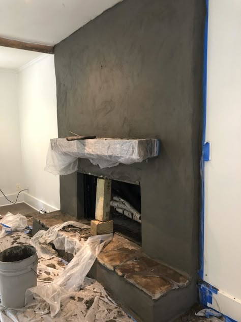 Stucco Fireplace Makeover, Fireplace Stucco, How To Stucco, Fireplace Resurfacing, Diy Stucco, Rustic Wood Mantle, Brick Wall Fireplace, Smooth Stucco, Black Mantle Fireplace