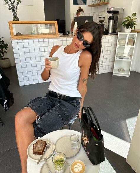 Coffee Shop. White Tank Top. Grey Cut Off Shorts. Black Sunglasses. Coffee Shop Aesthetic Photoshoot, Summer Coffee Shop Outfit, Cafe Shoot Ideas, Cafe Inspo Pics, Cafe Aesthetic Pose, White Sunglasses Outfit, Cafe Photoshoot Ideas, Cafe Pose Ideas, Cafe Shoot