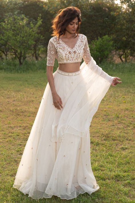 Luxury Chanderi Lehenga In Off White, Luxury Unstitched White Lehenga, Luxury White Unstitched Lehenga, Luxury Off White Chanderi Lehenga, Luxury Off White Choli For Diwali, Luxury White Blouse Piece With Sheer Dupatta, Luxury White Lehenga For Transitional Season, Bohemian Blouse With Dupatta For Traditional Ceremonies, Luxury Off White Lehenga For Festive Occasions