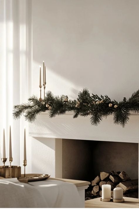 Transform your holiday mantel into a serene masterpiece with these minimalist Christmas decorating ideas! Learn the secrets to creating a beautiful, clutter-free display using natural elements, strategic lighting, and carefully chosen accents. Perfect for modern and traditional homes alike. Some of the links in my articles are affiliate links. If you make a qualified purchase from one of my links I will make a small commission at no cost to you. Thank you for your support!!! Minimal Christmas Mantle, Minimalist Christmas Mantle, Minimal Mantle Decor, Japandi Christmas, Minimal Holiday Decor, Display Shelves Decor, Tree Decorating Tips, Minimalist Holiday Decor, Winter Wreath Diy