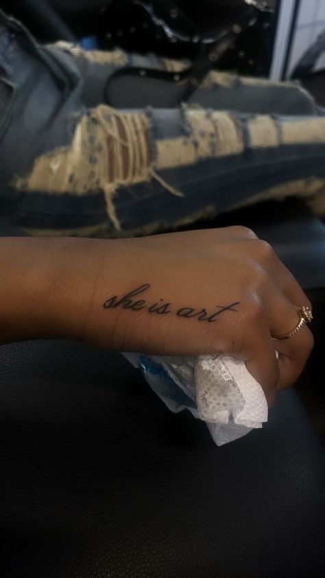 Small Design Tattoos For Women, One Word Hand Tattoos For Women, Small Girl Tattoos Black Women, One Word Wrist Tattoos, Small Tattoos For Black Skin, Word Hand Tattoos For Women, Small Tattoos With Meaning For Women, Small Word Tattoos For Women, Tattoo On Side Of Hand