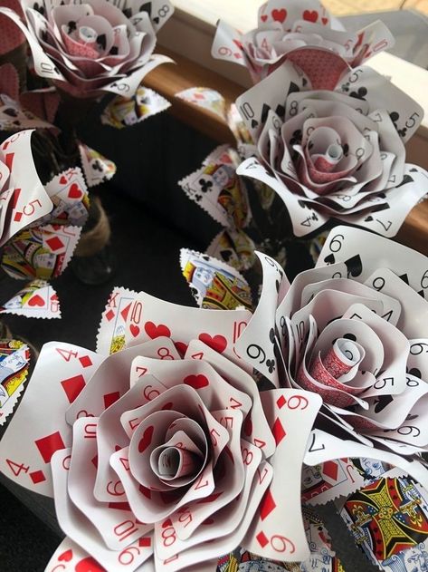 How To Make Roses Out Of Playing Cards, How To Make A Rose Out Of Playing Cards, Playing Cards Alice In Wonderland, Playing Cards Flowers, Playing Card Flowers Diy, Card Game Decorations, Alice In Wonderland Set Design Ideas, Playing Card Decoration Ideas, Playing Card Roses Diy